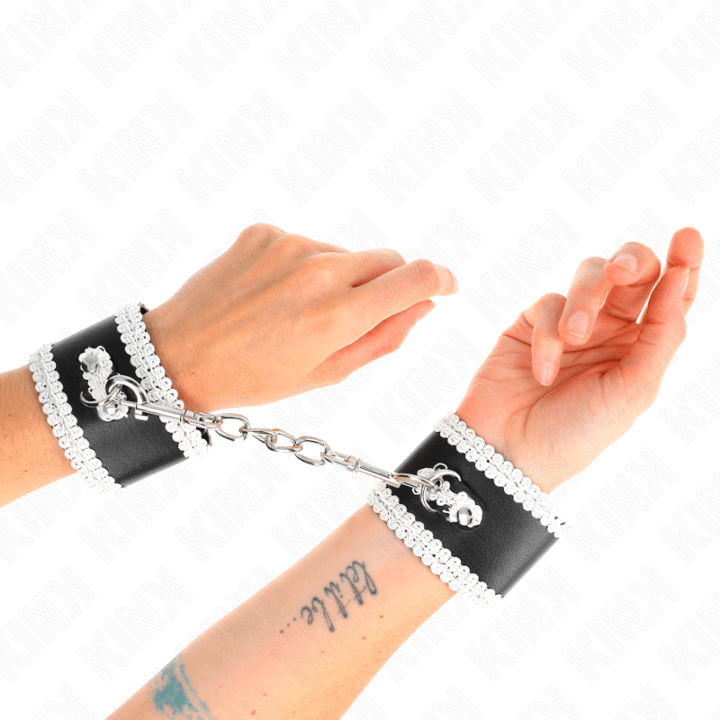 KINK - BLACK WRIST RESTRAINTS WITH WHITE DECORATE LACE ADJSUTABLE 20 - 23 CM X 5.5 CM - Kink&Play
