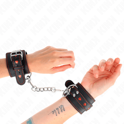 KINK - BLACK WRIST RESTRAINTS WITH RED HEART INLAY ADJUSTABLE 21 - 28 CM X 5.5 CM - Kink&Play