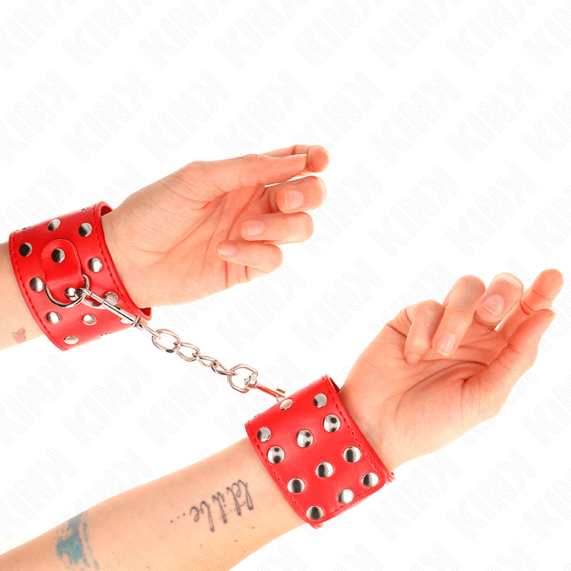 KINK - WRIST RESTRAINTS WITH SNAP FASTEN FULL OF RIVETS RED ADJUSTABLE 19 - 24 CM X 5.5 CM - Kink&Play